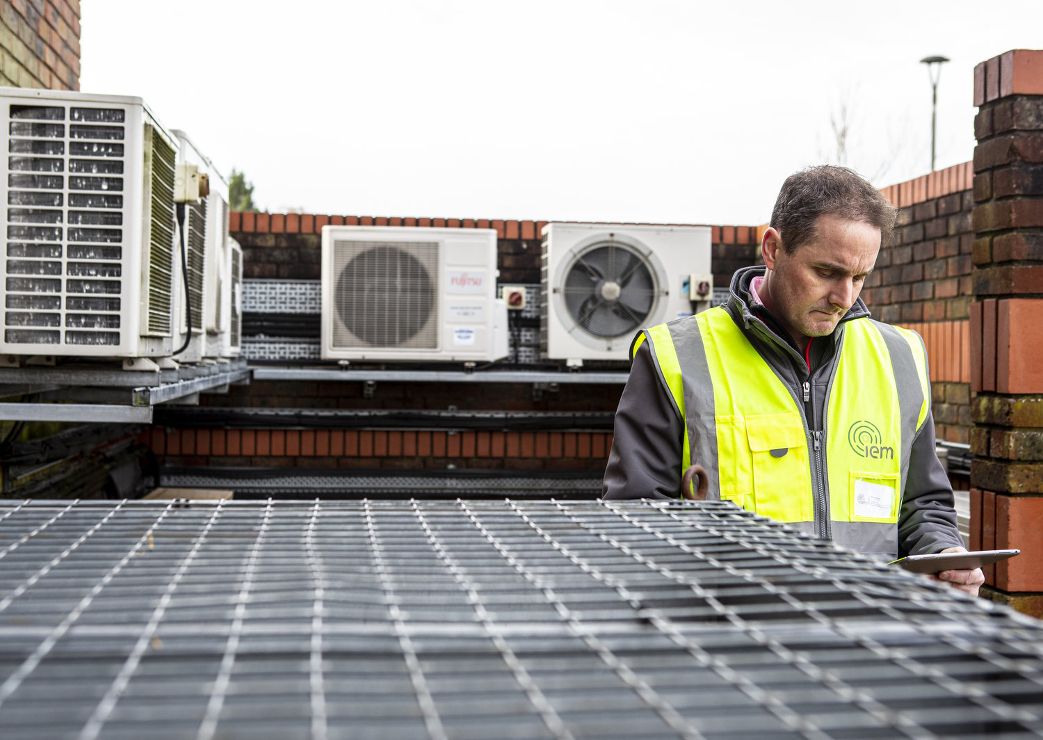 IEM Team Member checking roof